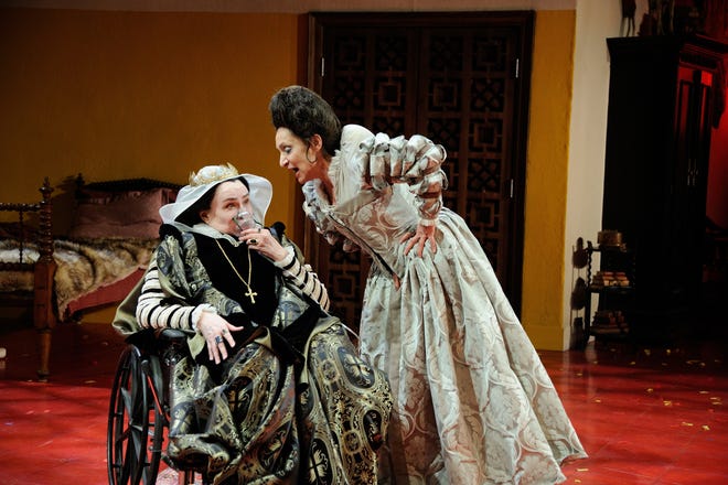 Janice Duclos as a seated Queen Isabella and Phyllis Kay as her adopted sister Maxima Terrible Segunda in Trinity Rep's "The Hunchback of Seville.



Mark Turek