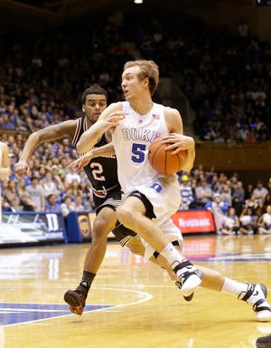 Louisville's Quentin Snider, left, guards Duke's Luke Kennard during the second half on Monday in Durham, N.C. Duke won 72-65. (AP Photo/Gerry Broome)