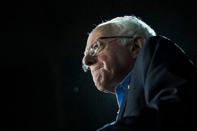 Democratic presidential candidate Sen. Bernie Sanders, I-Vt., grimaces as he delivers his stump speech during a campaign stop at the University of New Hampshire Whittemore Center Arena, Monday, Feb. 8, 2016, in Durham, N.H. (AP Photo/John Minchillo)