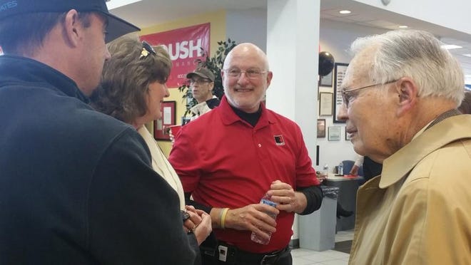 Lyle Sturgis, center, works the crowd at an award ceremony for Tindol Ford in Gastonia. He was named Roush's No. 1 dealer worldwide for 2015.