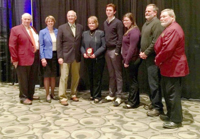 Wayne Nichols’ family is pictured with members of the Michigan Association of Fairs & Exhibition after a recent hall of fame induction. Family members include Ed and Pam Nichols (grandson), Debbie Layman (granddaughter), Michael Layman (great-grandson), Heather Layman (great-granddaughter) and Jeff Layman. COURTESY PHOTO