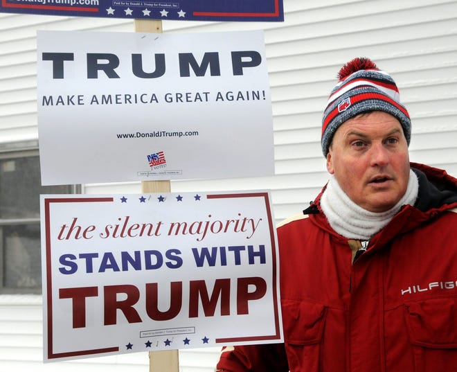 Chris Dawe of Hampton Falls shows his support for Donald Trump at the polls during the New Hampshire Primary on Tuesday. Photo by Deb Cram/Seacoastonline