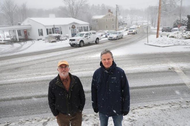 York's Historic District Commission Chair Robert Cutts, left, and Secretary Scott Stevens stand in the center of the town with the Bank of America building in the background.

Photo by Deb Cram/Seacoastonline