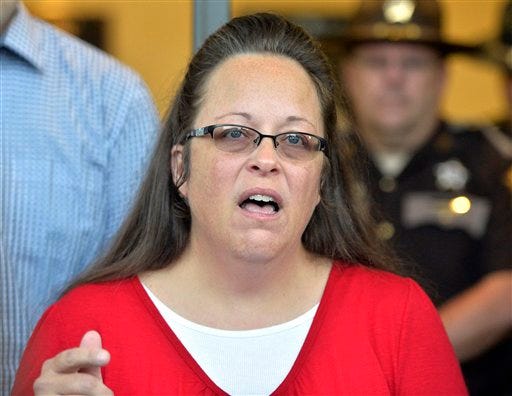 FILE - In this Sept. 14, 2015 file photo, Rowan County, Ky., Clerk Kim Davis speaks in Morehead, Ky. Davis, the Kentucky clerk who spent five days in jail for defying federal court orders and refusing to license same-sex marriage, will have a seat at the president's final State of the Union. (AP Photo/Timothy D. Easley, File)