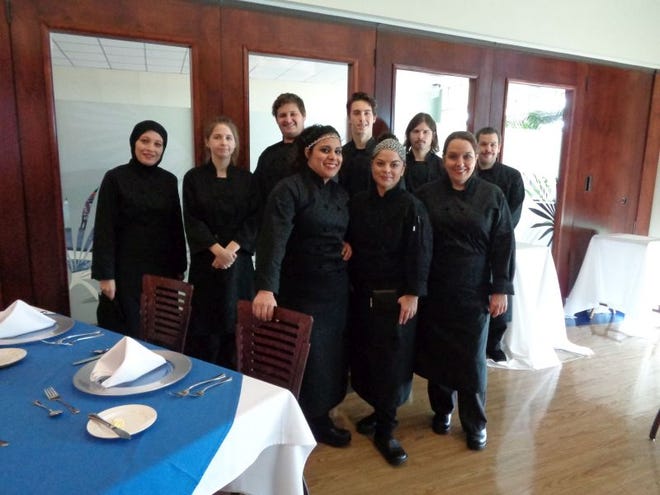 As part of the culinary program, Gulf Coast State College culinary students rotate from meal preparation in the kitchen to the front of the house for service in the John Holley Dining Room.