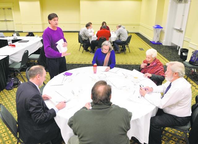 Members of the Athens-Clarke County commission discuss matters Wednesday at The Classic Center.