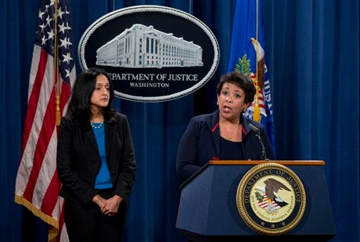 Attorney General Loretta Lynch, joined by Principal Deputy Assistant Attorney General Vanita Gupta speaks during a news conference at the Justice Department in Washington, Wednesday, Feb. 10, 2016, about Ferguson, Missouri. The federal government sued Ferguson on Wednesday, one day after the city council voted to revise an agreement aimed at improving the way police and courts treat poor people and minorities in the St. Louis suburb. (AP Photo/Carolyn Kaster)