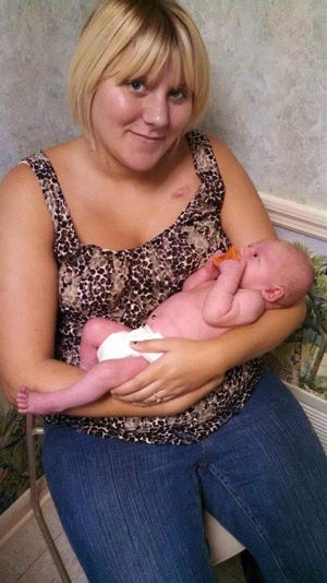Angelique Potter, 23, and her 10-week old son, Terry William Peterson, were killed Aug. 14, 2014, when a Volusia County dump truck that had a tire blowout collided into her sport utility vehicle. The county paid her family $300,000 on Feb. 4. Provided by Potter's family via Facebook