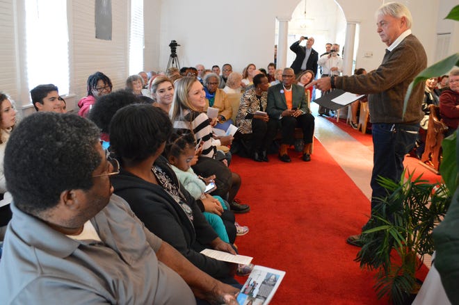 Port Orange Mayor Allen Green works his way around the Mt. Moriah Baptist Church during the town's Freemanville Day celebration, Tuesday, Feb. 9, 2016, as he has everyone introduce themselves to the rest of the group. The annual event fetes the black community which was established in 1866 by 500 former slaves just after the Civil War. | NEWS-JOURNAL/CASMIRA HARRISON