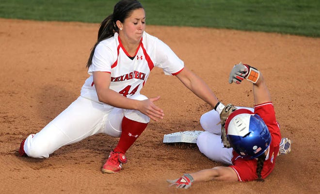 Texas Tech's Brooke Scott reaches for the tag as Kansas' Maggie Hull steals second during a game at Rocky Johnson Field.