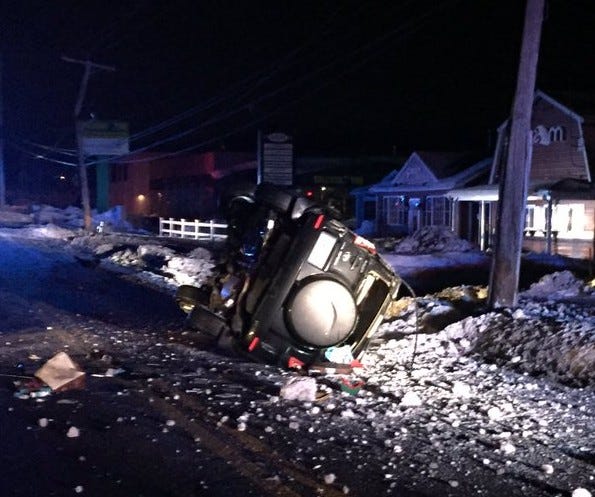 Two men were injured in a rollover crash into a utility pole after the driver fled from Weymouth Police into Abington early Wednesday morning, Feb. 10, 2016. The crash happened at 1200 Bedford St. in Abington.