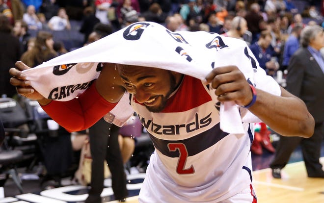 Washington Wizards guard John Wall smiles after a recent victory over the 76ers. (AP Photo/Alex Brandon, File)