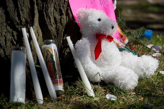 Candles, stuffed animals and messages are seen at a memorial site for 13-year-old Gaillen Baker on Monday, Sept. 21, 2015, in Rockford. RRSTAR.COM FILE PHOTO