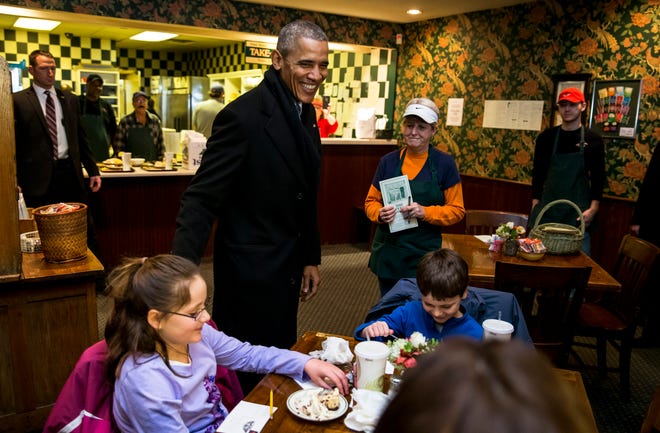 President Barack Obama visits with patrons while stopping to order lunch at The Feed Store while on his way to the Illinois State Capitol, Wednesday, Feb. 10, 2016, in Springfield, Ill. Justin L. Fowler/The State Journal-Register