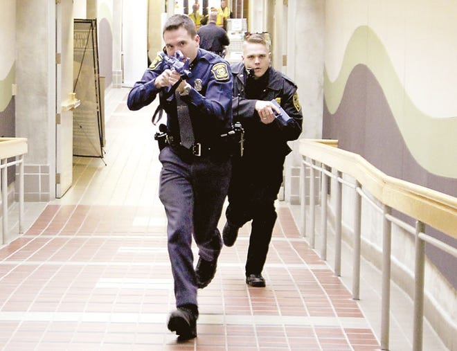 Michelle Patrick/Journal
Local law enforcement officials respond to a mock active-shooter incident Tuesday at Glen Oaks Community College. The drill involved several local police and fire departments, emergency workers and faculty members.
