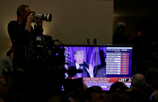 A television screen displays voting results during a primary night rally for Republican presidential candidate, businessman Donald Trump on Tuesday, Feb. 9, 2016, in Manchester, N.H.