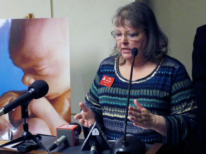 Kathy Ostrowski, lobbyist and legislative director for the anti-abortion group Kansans for Life, criticizes a state Court of Appeals ruling on abortion, Friday, Jan. 22, 2016, at the Statehouse in Topeka, Kan. The ruling blocked enforcement of the stateís first-in-the-nation ban on a common second-trimester procedure. (AP Photo/John Hanna).