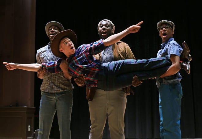 Perfomers in the upcoming musical revue, "Smokey Joe's Cafe," rehearse in the Star Thatre at the Kittery Community Center on Friday. Back from left, Christopher Young, Marc-Anthony Lewis, and Michael Jemison lift up Devin Price, front.

Ioanna Raptis/Seacoastonline