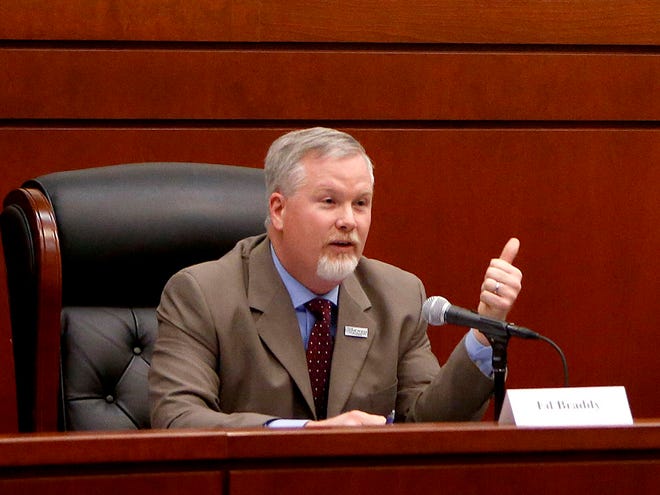 Gainesville Mayor Ed Braddy speaks during a candidate forum at the UF Levin College of Law on Wednesday.