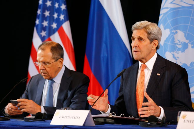 U.S. Secretary of State John Kerry, right, and Russian Foreign Minister Sergey Lavrov attend a news conference after the International Syria Support Group (ISSG) meeting in Munich, Germany, Friday, Feb. 12, 2016.