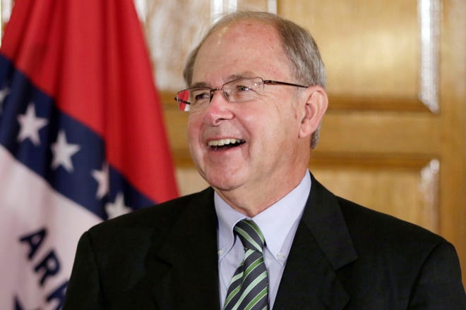 FILE- In this Aug. 25, 2015 file photo, Howard Brill attends a news conference at the Arkansas state Capitol in Little Rock, Ark. Interim Chief Justice Howard Brill on Thursday, Feb. 11, 2016, cited Cash's song "Starkville City Jail" in a dissent. He said it was wrong for the majority to deny a Benton County man's objection to a $300,000 cash-only bail set in an assault and battery case. (AP Photo/Danny Johnston, File)