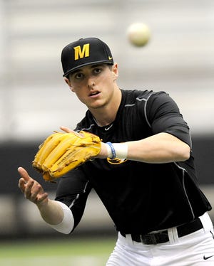 Missouri junior shortstop Ryan Howard warms up Thursday in the Devine Pavilion. Howard and the Tigers will open the 2016 season next Friday against Seton Hall in Fort Myers, Fla.