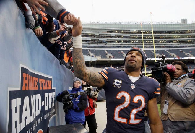 In this Jan. 3, 2016, file photo, Chicago Bears running back Matt Forte reaches up to fans fans after an NFL football game against the Detroit Lions in Chicago. Forte, a two-time Pro Bowl running back announced on Instagram Friday, Feb. 12, 2016, morning that the team informed him this week it will not offer him a contract for next season.