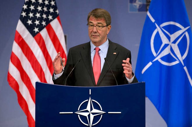 U.S. Secretary of Defense Ash Carter speaks during a media conference at NATO headquarters in Brussels on Thursday, Feb. 11, 2016. NATO defense ministers met for a second day on Thursday to discuss Turkey's request to help deal with Europe's ongoing migrant crisis and the current situation in Iraq and Syria. (AP Photo/Virginia Mayo)