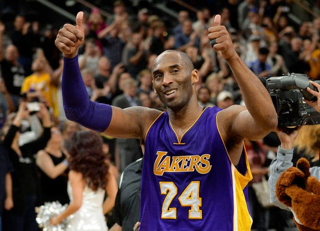 FILE - In this Saturday, Feb. 6, 2016 file photo, Los Angeles Lakers guard Kobe Bryant gestures to fans as he walks off of the court after an NBA basketball game against the San Antonio Spurs in San Antonio. The final NBA All-Star Game for Bryant and the first to be staged outside the U.S. is in Toronto, the city that staged the first NBA game 70 years ago and is so enthusiastic for basketball now that it could no longer be ignored no matter what the thermometer says. (AP Photo/Darren Abate, File)