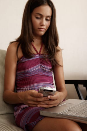 Detective Matthew Fleming, during an Internet safety talk for parents in Greenland, warned that 1 in 5 kids receive unwanted solicitation online and only about a quarter of them tell their parents. Photo illustration