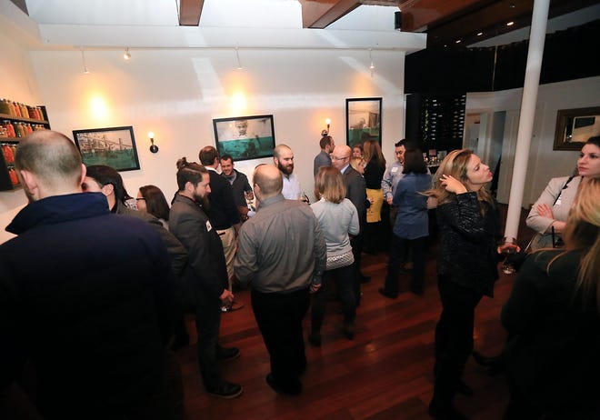 Young professionals mingle at the launch party for the third annual Catapult Seacoast 10 to Watch contest honoring people ages 21-40 who contribute to the local economy and community at The Franklin Oyster House in Portsmouth, NH on Wednesday.

Photo by Ioanna Raptis/Seacoastonline