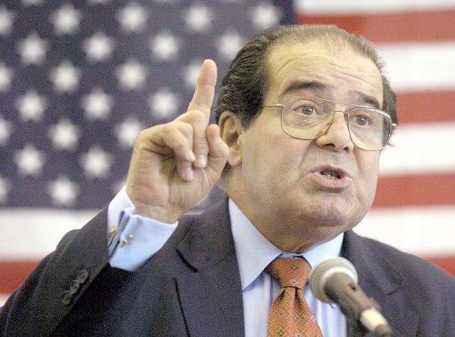 U.S. Supreme Court Justice Antonin Scalia speaks to Presbyterian Christian High School students in Hattiesburg, Miss., on April 7, 2004. On Saturday,the U.S. Marshall's Service confirmed that Scalia has died at the age of 79.