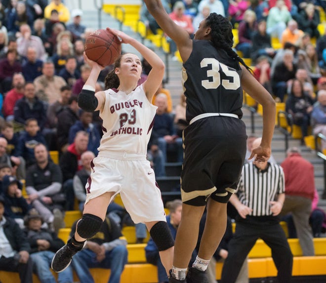 Quigley's Ashley Mineard, left, shoots from the baseline while Imani Christian's Lexus Santiago tries to block the shot Saturday at North Allegheny High School during Quigley's 82-54 win in the WPIAL Class A playoffs.