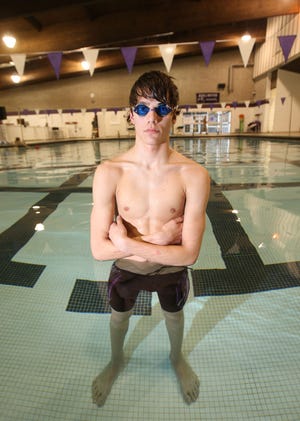 Burlington High School senior Keaton Sattler poses for a photo on Thursday at the BHS pool. Sattler broke the 50-yard freestyle record with a time of 21.52 seconds, beating the 30-year-old school record by nearly half a second.