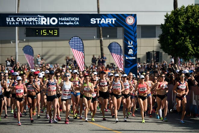 Runners compete at the start of the women's qualifier during the U.S. Olympic marathon trials, Saturday, Feb. 13, 2016, in Los Angeles. (AP Photo/Kelvin Kuo)