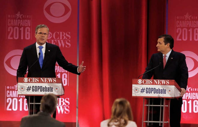 Republican presidential candidate, former Florida Gov. Jeb Bush, left, speaks as Republican presidential candidate, Sen. Ted Cruz, R-Texas, looks on during the CBS News Republican presidential debate at the Peace Center, Saturday, Feb. 13, 2016, in Greenville, S.C. (AP Photo/John Bazemore)