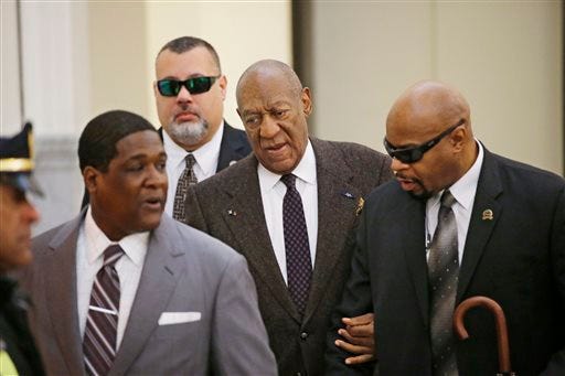 Actor and comedian Bill Cosby arrives for a court appearance Wednesday, Feb. 3, 2016, in Norristown, Pa. Cosby was arrested and charged with drugging and sexually assaulting a woman at his home in January 2004. A judge will decide whether to dismiss a sexual assault case against the comedian over an unwritten promise of immunity that a former prosecutor says he gave Cosby's now-deceased lawyer. (Ed Hille/The Philadelphia Inquirer via AP, Pool)