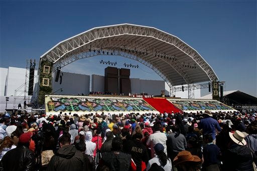 People listen to Pope Francis as her gives Mass in Ecatepec, Mexico, Sunday, Feb. 14, 2016. Hundreds of thousands of people gathered Sunday as Pope Francis began what was expected to be the biggest event of his five-day trip to Mexico. (AP Photo/Dario Lopez-Mills)