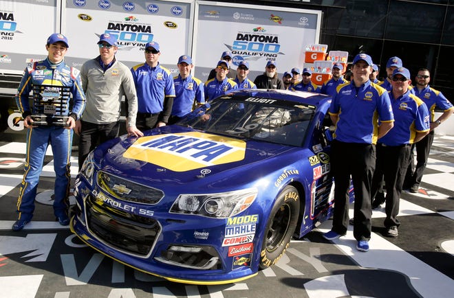 Chase Elliott, far left, poses for photos with his crew after he qualified for the pole position in the NASCAR Daytona 500 auto race at Daytona International Speedway Sunday in Daytona Beach, Fla. Photo by AP