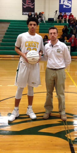 Crest High senior Jaylon Wray, here with head coach Justin Zaleski, went over the 1,000-point mark for his career in Saturday's tournament win over East Rutherford. The Chargers meet rival Shelby in Tuesday's 6 p.m. semifinal at Kings Mountain.