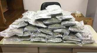 Provided Photo - Department of Public Safety troopers responding to a car fire in Gray County found 26 pounds of marijuana inside gift-wrapped boxes.