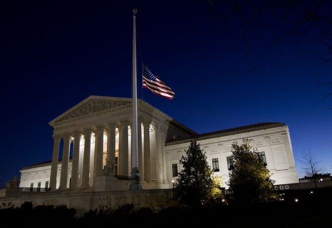 A flag flies at half-staff Sunday in front of the U.S. Supreme Court to mourn the death of Supreme Court Justice Antonin Scalia, 79. The process to replace the conservative jurist is off to a contentious start, with Republicans claiming that President Barack Obama should leave the nomination of a new justice to his successor.