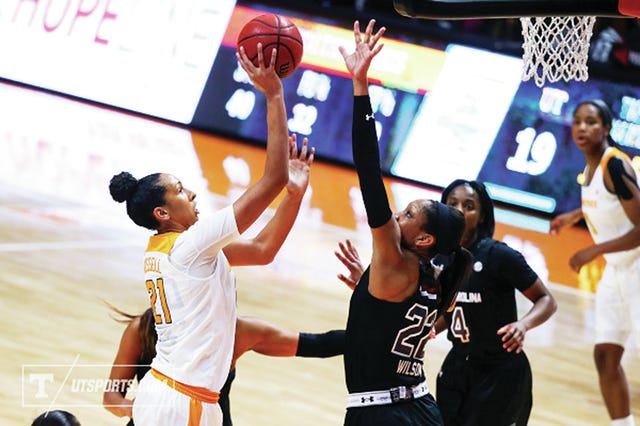 Mercedes Russell (21) of Tennessee tries to shoot over A'Ja Wilson of South Carolina at Thompson-Boling Arena in Knoxville. (Photo By Donald Page/Tennessee Athletics)