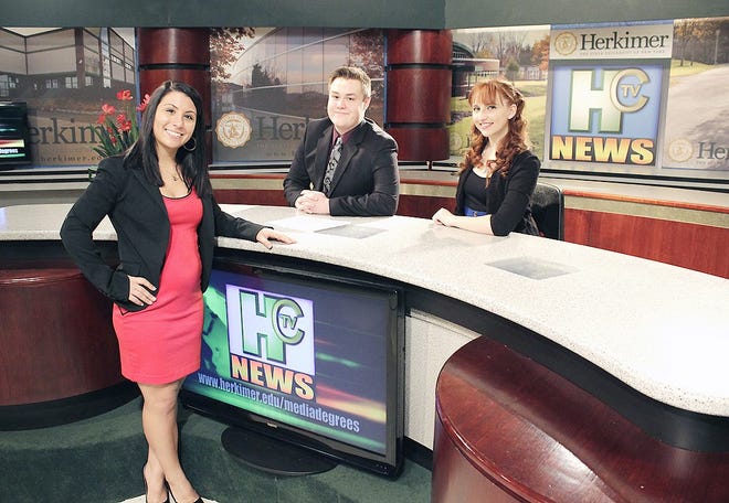 Pictured are Communication Arts students Lauren Rabbia, Jack Sehn and Bridget Roberts on the set of HCTV News. SUBMITTED PHOTO