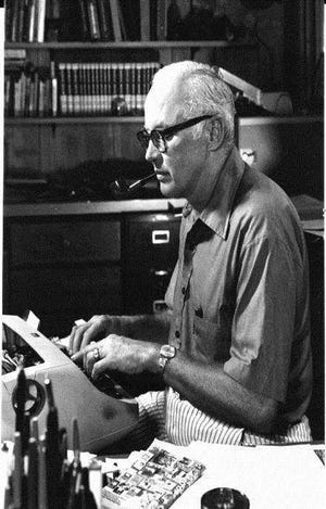 John D. MacDonald, creator of the Travis McGee character and novels and many other short stories and novels, is pictured at his typewriter in the late 1970s.