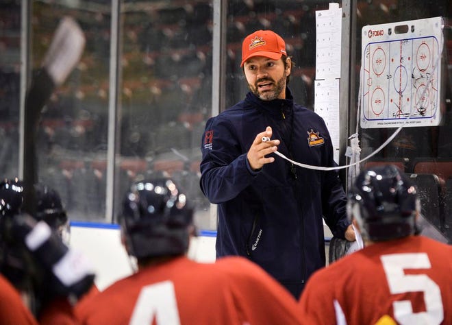 Rivermen coach Jean-Guy Trudel talks with players during a practice earlier this season.