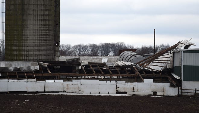 The roof of a barn at Tanner Brothers Dairy Farm in Northampton was damaged during storms on Tuesday, Feb. 16, 2016.