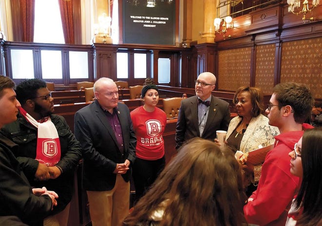 A Bradley University group speaks with state Sen. David Koehler, D-Peoria, in bow tie, and Sen. Mattie Hunter, D-Chicago, about funding for MAP grants during a brief meeting on the Senate floor Tuesday.