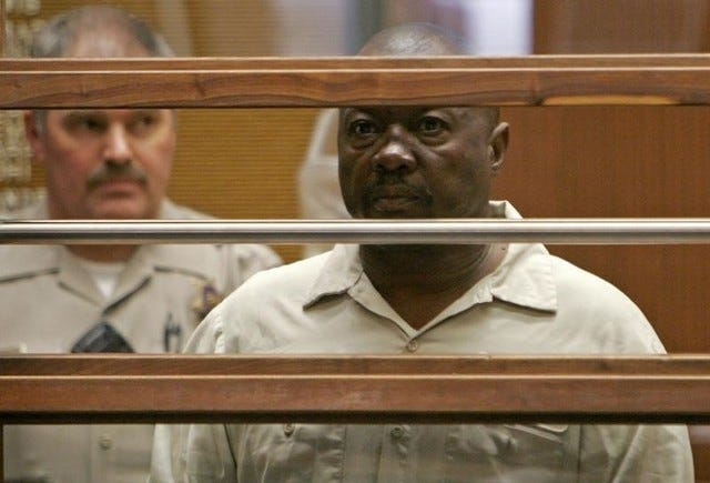 Lonnie David Franklin Jr. stands in court during his arraignment in Los Angeles Criminal Court in this July 8, 2010, file photo. (REUTERS/Al Seib/Pool)