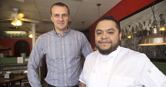 Owner Maksym “Max” Serdiukov, left, and manager Richard Reyes run Digino's Pizza in Tavares. “I liked this business very much and have always been interested in restaurants,” Serdiukov said. “It’s different from what I did in the Ukraine but I wanted to challenge myself and see if I could do it or not.” CINDY DIAN / CORRESPONDENT